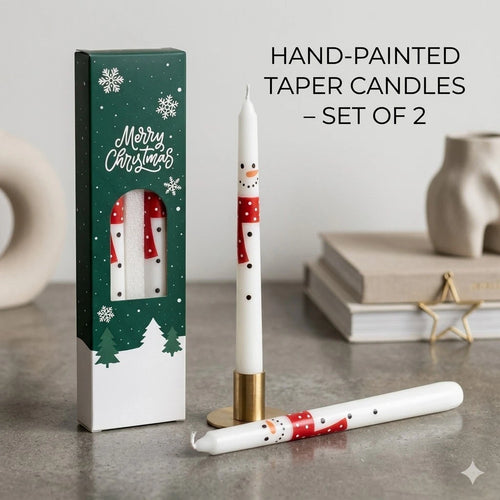 Set of 2 artisan hand-painted snowman taper candles in winter holiday packaging