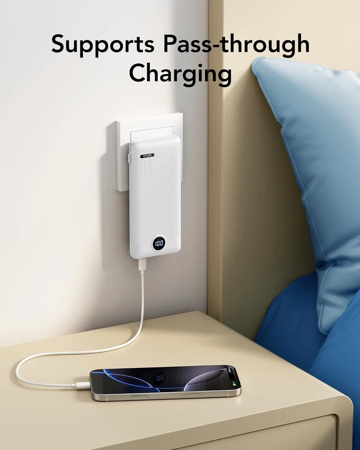Portable charger plugged into a wall outlet showing pass-through charging support